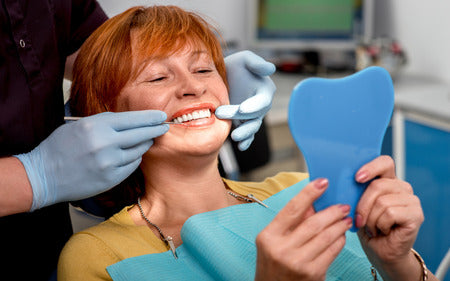 Dentures vs. Implants – Which One is Better?